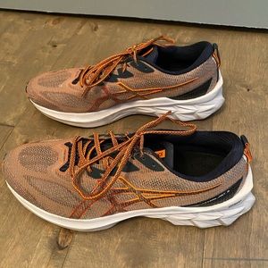ASIC Novablast 2 sneakers. Size 11.5 Mens. Good condition. Orange color.
